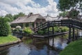 The bridge leading to the house across the canal.